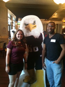 two Auggies pose with Auggie Eagle standup